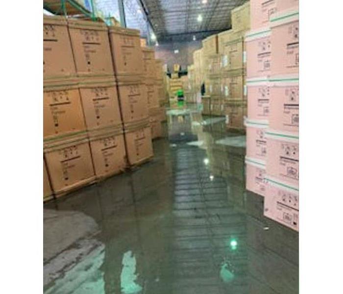 Standing water in warehouse facility.