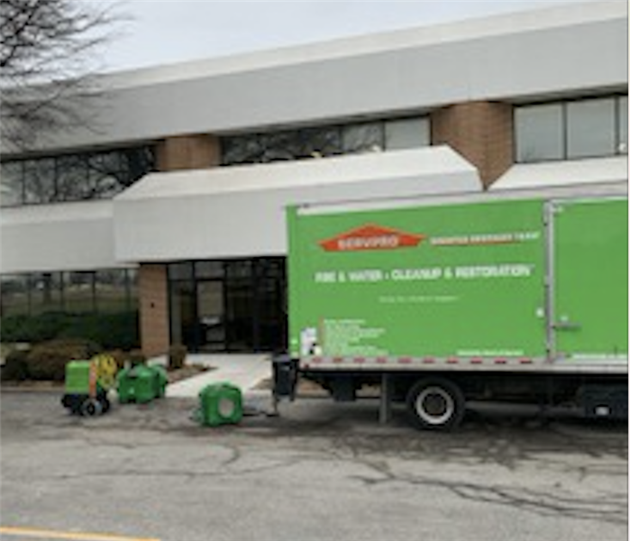 SERVPRO truck outside commercial structure.