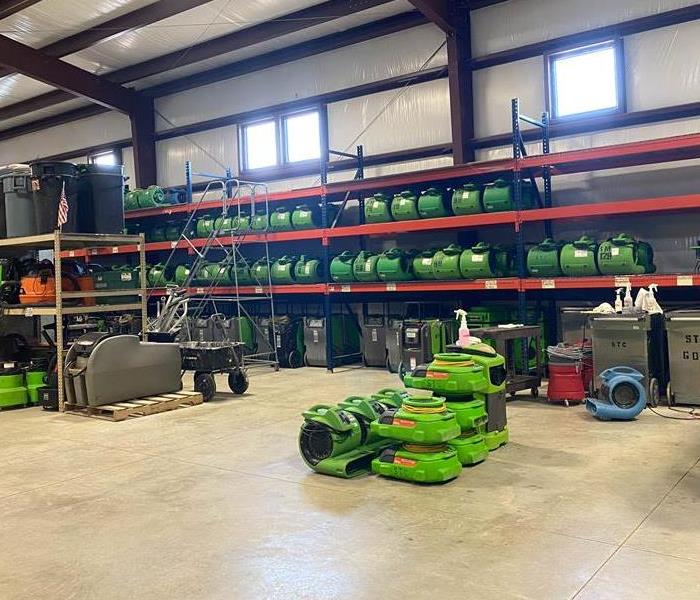 a warehouse with green equipment