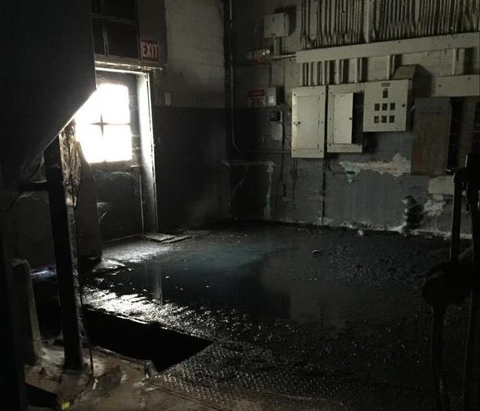 Pool of water in commercial ware house facility.